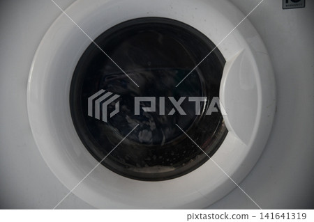 Water splash of the washing machine drum. Water splash of the washing machine drum. 141641319