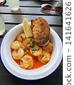 Garlic Shrimp with Toasted Bread and Lemon on Summer Restaurant Terrace, Top View 141641626