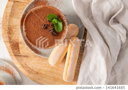 Creamy Tiramisu Cup with Cocoa and Ladyfingers Creamy Tiramisu Cup with Cocoa and Ladyfingers 141641685