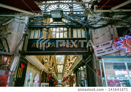Istanbul, turkey, august 2, 2025 avrupa pasaji sign marking the entrance of a historic shopping arcade with many stores and turkish flags in istanbul, turkey Istanbul, turkey, august 2, 2025 avrupa pasaji sign marking the entrance of a historic shopping arcade with many stores and turkish flags in istanbul, turkey 141641871