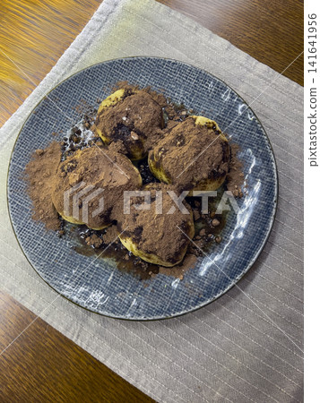 Round Sweet Dumplings with Cocoa and Chocolate Sauce Round Sweet Dumplings with Cocoa and Chocolate Sauce 141641956
