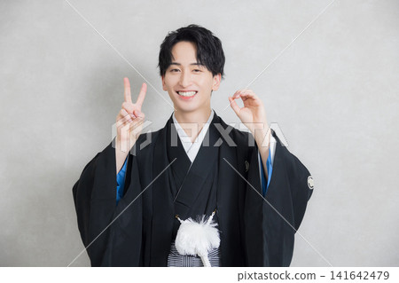A young man in a hakama with family crest A young man in a hakama with family crest 141642479