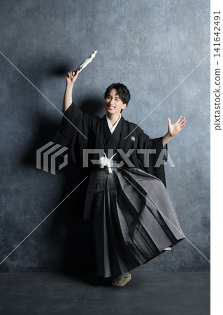 A young man in a hakama with family crest 141642491
