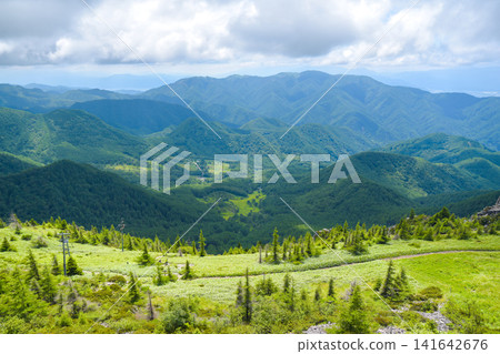 A spectacular view from Ōgatō: Lush summer mountain scenery of Shinshu. A spectacular view from Ōgatō: Lush summer mountain scenery of Shinshu. 141642676