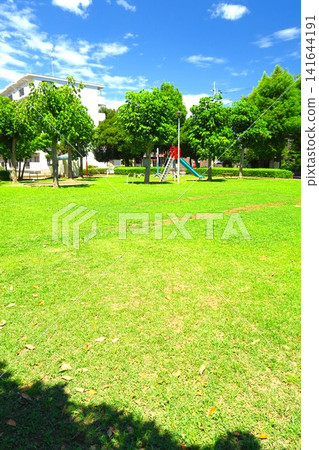 A deserted park scene in a residential area on a scorching hot summer day. A deserted park scene in a residential area on a scorching hot summer day. 141644191