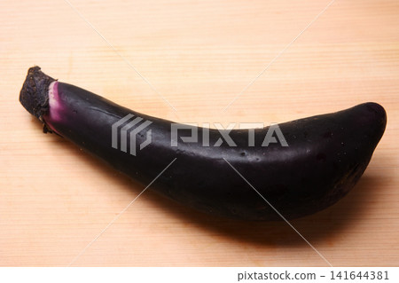 Eggplant on a cutting board Eggplant on a cutting board 141644381