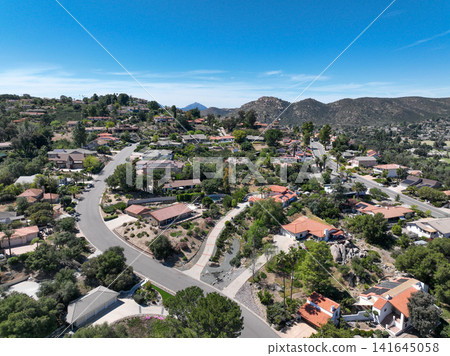 Aerial view of Ramona neighborhood with mountain, valley and golf course Aerial view of Ramona neighborhood with mountain, valley and golf course 141645058