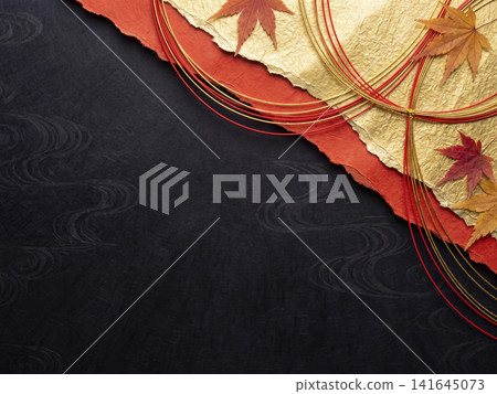 A background featuring flowing mizuhiki (decorative cords) on diagonally divided black washi and torn vermilion washi. 141645073