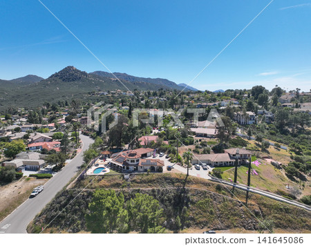 Aerial view of Ramona neighborhood with mountain, valley and golf course Aerial view of Ramona neighborhood with mountain, valley and golf course 141645086