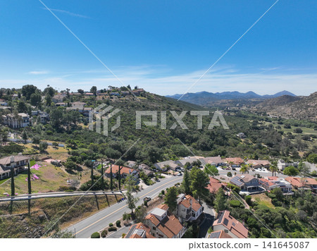 Aerial view of Ramona neighborhood with mountain, valley and golf course Aerial view of Ramona neighborhood with mountain, valley and golf course 141645087