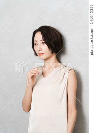 Posing short-haired woman beauty image Posing short-haired woman beauty image 141645335