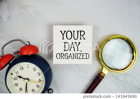 Your Day, Organized text with sticky note and alarm clock flat lay on marble background Your Day, Organized text with sticky note and alarm clock flat lay on marble background 141645690