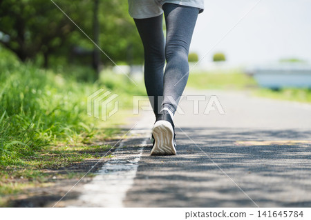 Young woman running sports image Young woman running sports image 141645784