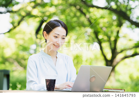 Nomad worker working outdoors Business image Nomad worker working outdoors Business image 141645793