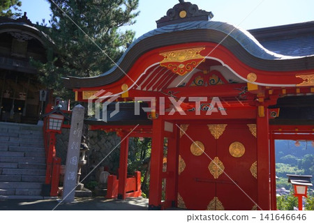 Taikodani Inari Shrine: A magnificent vermilion-lacquered shrine building against a blue sky. One of Japan's five major Inari shrines and a popular tourist spot in Tsuwano. Taikodani Inari Shrine: A magnificent vermilion-lacquered shrine building against a blue sky. One of Japan's five major Inari shrines and a popular tourist spot in Tsuwano. 141646646