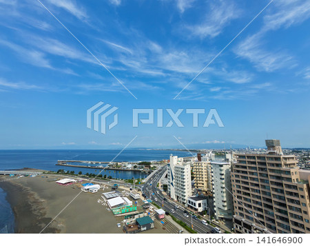A photo taken from the coast of Enoshima, showing the sandy beach and the townscape along the Shonan coast. A photo taken from the coast of Enoshima, showing the sandy beach and the townscape along the Shonan coast. 141646900