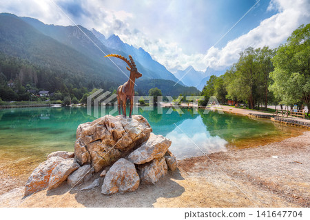 Gorgeous landscape on Jasna lake with beautiful reflections of the mountains. Gorgeous landscape on Jasna lake with beautiful reflections of the mountains. 141647704
