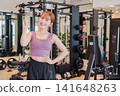 Young female gym instructor 141648263