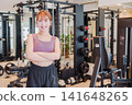 Young female gym instructor 141648265