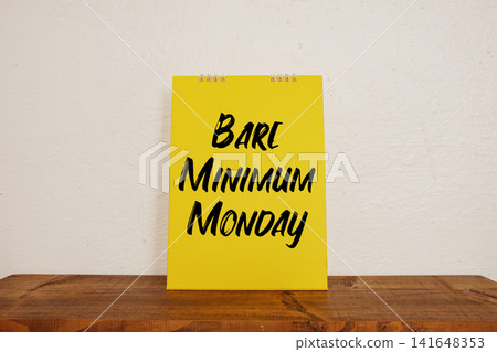 Bare Minimum Monday text wirten on calendar mockup Bare Minimum Monday text wirten on calendar mockup 141648353