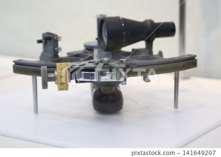 A close-up of a sextant, a nautical instrument. 141649207