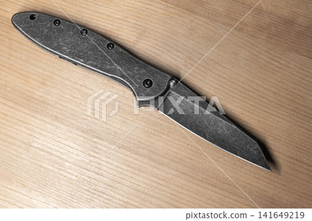Black folding pocket knife with a stonewashed steel blade 141649219
