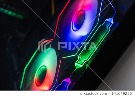Vibrant RGB fans illuminate a custom gaming PC interior Vibrant RGB fans illuminate a custom gaming PC interior 141649236