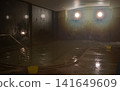 Taking a bath in the hot springs at night 141649609