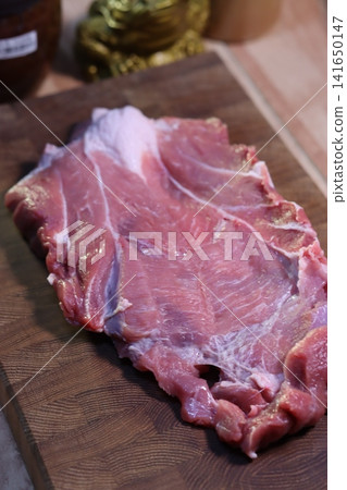 Raw Meat on Wooden Cutting Board 141650147
