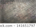 Rainy cobblestone background 141651797