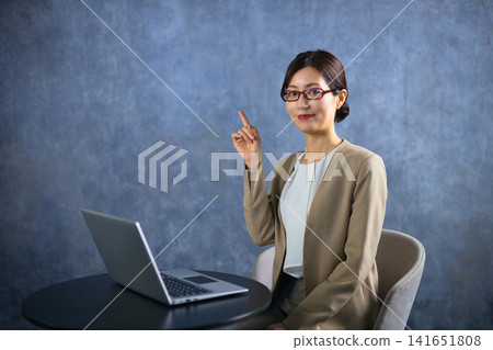 Business woman using a personal computer Business woman using a personal computer 141651808