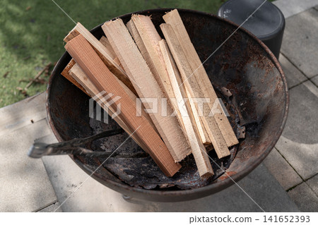 Firewood, campfire, fire pit, camping, firewood stacking, outdoor, barbecue, fire starting, camping equipment Firewood, campfire, fire pit, camping, firewood stacking, outdoor, barbecue, fire starting, camping equipment 141652393