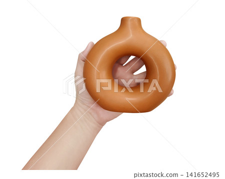 A modern-style brown vase is in a man's hands against a white background. A modern-style brown vase is in a man's hands against a white background. 141652495