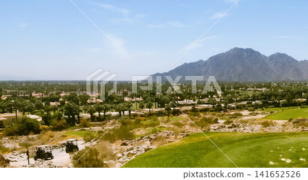 The refreshing resort scenery of La Quinta, with its golf course and majestic mountain ranges. The refreshing resort scenery of La Quinta, with its golf course and majestic mountain ranges. 141652526
