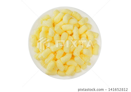 Glazed corn sticks on a plate isolated on a white background. Puffed sweet snack. Top view. Sugar coated corn sticks. Gluten free. Glazed corn sticks on a plate isolated on a white background. Puffed sweet snack. Top view. Sugar coated corn sticks. Gluten free. 141652812