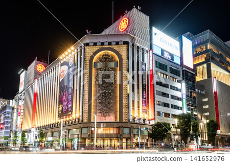Night view of the Ginza Mitsukoshi, Tokyo, Japan. Isetan and Mitsukoshi were merged into a joint holding company, Isetan Mitsukoshi Holdings Ltd. 141652976