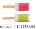 Ice cream on a stick with a bite mark isolated on a white background. Ice cream or fruit ice isolated on a white background. 141653409