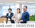 Middle-aged businessman working in an office. Photo courtesy of Denpa Gakuen, Tokyo Electronics College. 141653548