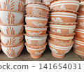 Stacked Handmade Terracotta Clay Flower Pots for Gardening and Outdoor Decoration 141654031