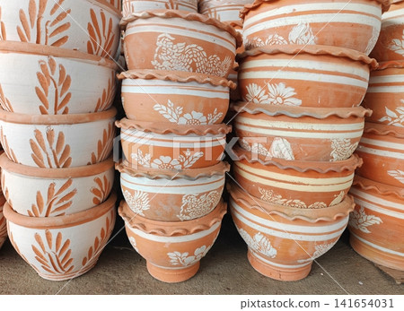 Stacked Handmade Terracotta Clay Flower Pots for Gardening and Outdoor Decoration Stacked Handmade Terracotta Clay Flower Pots for Gardening and Outdoor Decoration 141654031