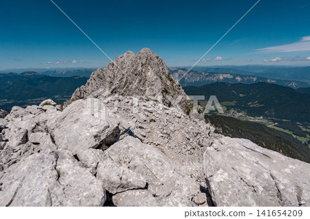 View from the middle Ponza mountain in Triglav National Park, Slovenia, towards the high Ponza peak with white rocky alpine valley routes, steep Julian Alps ridges and dramatic high mountain landscape View from the middle Ponza mountain in Triglav National Park, Slovenia, towards the high Ponza peak with white rocky alpine valley routes, steep Julian Alps ridges and dramatic high mountain landscape 141654209