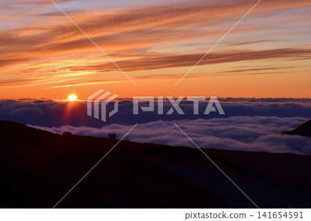 Sunset over the sea of clouds Sunset over the sea of clouds 141654591