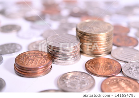 Newspaper, calculator, and coins Newspaper, calculator, and coins 141654793