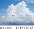 Cumulonimbus clouds, blue sky, and fighter jets 141655042