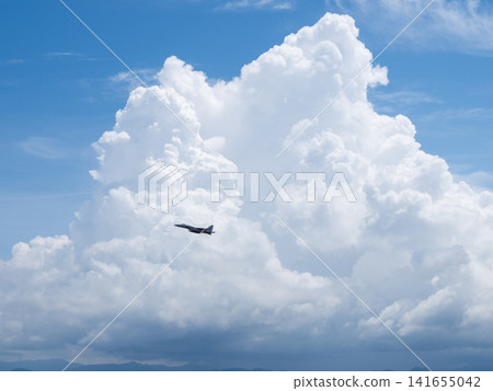 Cumulonimbus clouds, blue sky, and fighter jets Cumulonimbus clouds, blue sky, and fighter jets 141655042