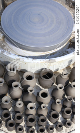 Unfired clay products made on a potters wheel. Unfired clay products made on a potters wheel. 141655294