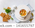 turkey meatball soup with carrots and potato 141655797