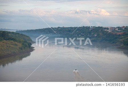 A motorboat traveling down the Paraná River A motorboat traveling down the Paraná River 141656193