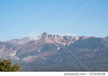 Mount Tokachi, a volcano summit on a clear autumn day. Mount Tokachi, a volcano summit on a clear autumn day. 141656386