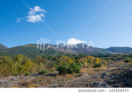 Volcanic peak covered with the first snow on a clear autumn day: Mt. Tokachi Volcanic peak covered with the first snow on a clear autumn day: Mt. Tokachi 141656415